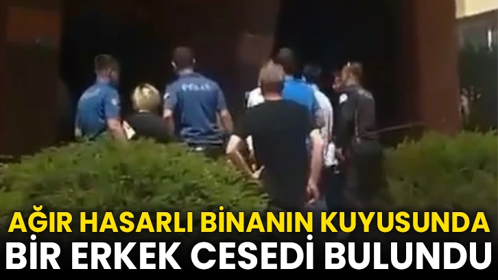 Ağır hasarlı binanın kuyusunda ceset bulundu