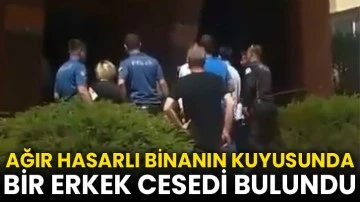 Ağır hasarlı binanın kuyusunda ceset bulundu