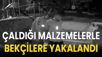 Çaldığı malzemelerle bekçilere yakalandı