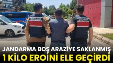 Jandarma boş araziye saklanmış 1 kilo eroini ele geçirdi