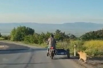 Köpeği motosikletin arkasına bağlayıp sürükledi !