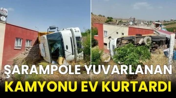 Şarampole yuvarlanan kamyonu ev kurtardı