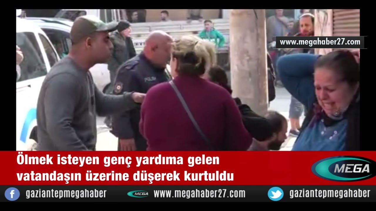 Ölmek isteyen genç yardıma gelen vatandaşın üzerine düşerek kurtuldu